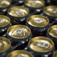Cans of beer connected by plastic six-pack rings